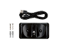 Black docking station with a USB cable, screws, and wall plugs on a black background.