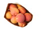 Fresh apricots in a paper bag, top-down view.