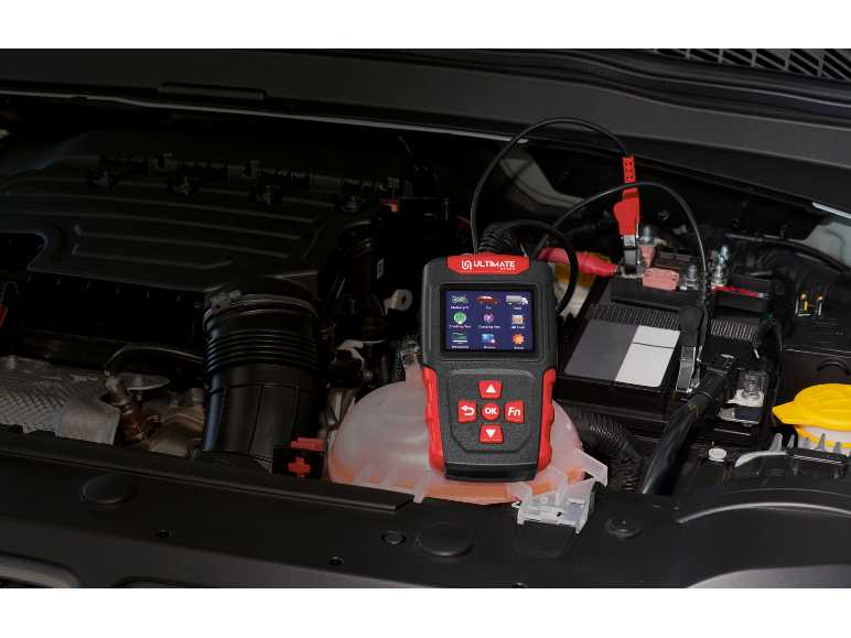Battery and alternator tester in a car engine.