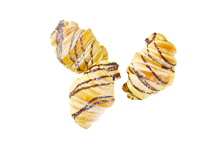 Three chocolate croissants with powdered sugar on a black background.