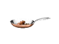 Copper frying pan with beef fillet and herbs.