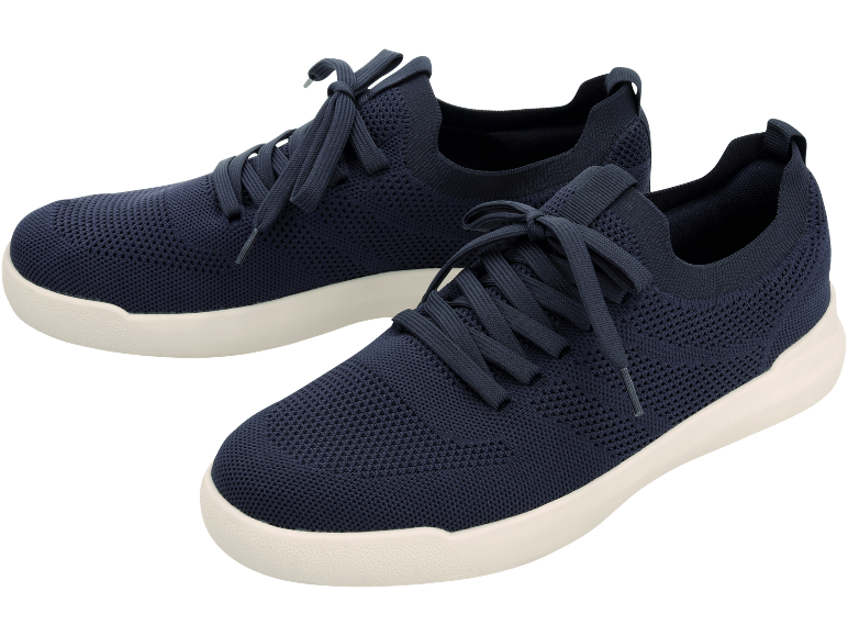 Pair of navy blue knitted sneakers with white soles.