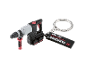 Keychain shaped like a rotary hammer drill with the inscription «PERFORMANCE EST. 1996».