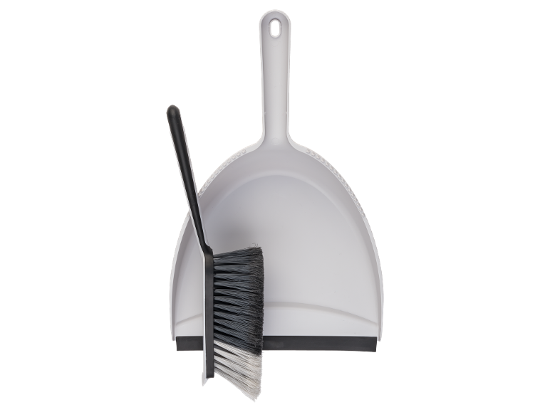Dustpan and brush in white and black.