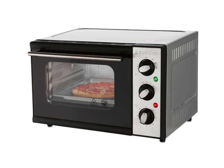 Compact black and silver mini oven with a pizza cooking inside.