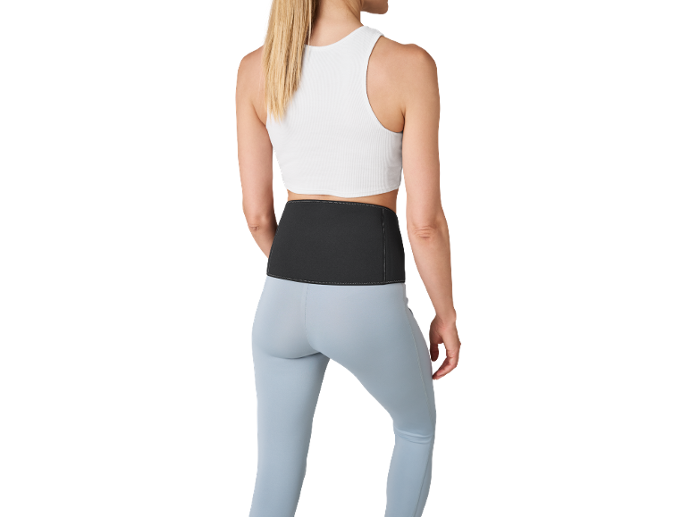 Woman in white top, light blue leggings, and black lumbar support belt.