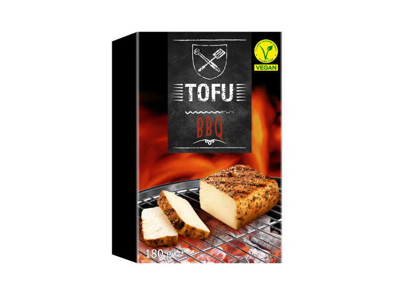 BBQ tofu on the grill with glowing embers, 180g, vegan certified.