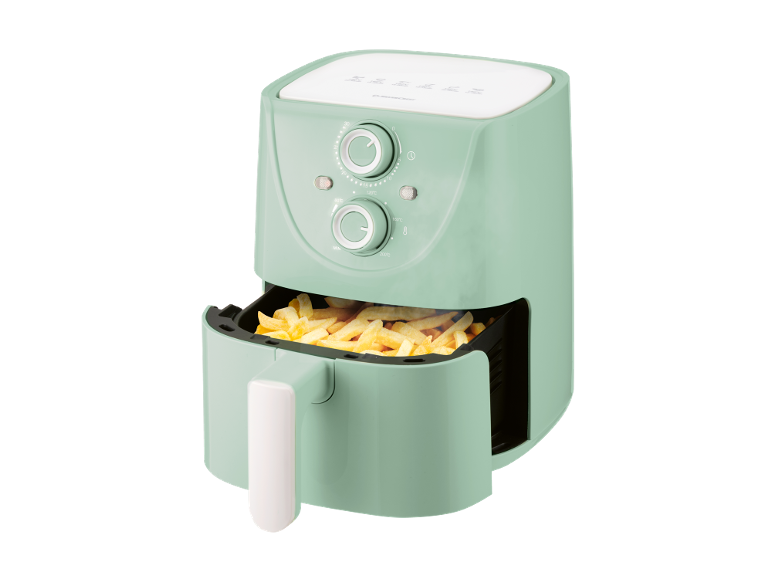 Mint green air fryer with french fries, featuring temperature and timer control knobs.