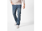 Men's blue jeans and beige sweatshirt with sneakers.