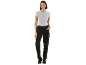 Woman in white t-shirt and black work trousers with black work shoes.