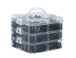 Clear three-tier storage box filled with black plastic clips and fasteners.