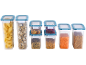 Clear food storage containers with blue lids, filled with pasta, cereal, nuts, chili, chickpeas, lentils, and wheat.