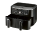 Black dual-basket air fryer with digital display showing 180°C and various cooking modes.