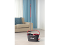 Mop and bucket with wringer in a modern living room.