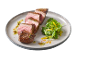 Sliced beef steak with sauce and arugula-mango salad on a plate.