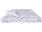 Folded white quilted duvet