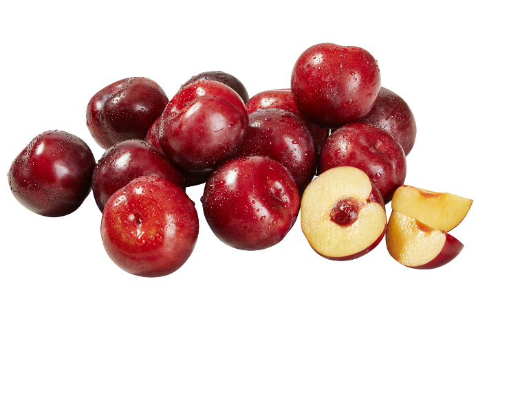 Fresh red plums, some cut in half, with water droplets.