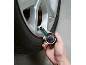 Tyre pressure gauge checking the pressure in a car tyre.