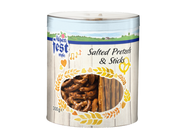 Can of salted pretzels and sticks with an alpine-style design and a transparent window.