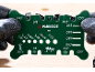 Green chainsaw sharpening guide with various measurements and gauges.