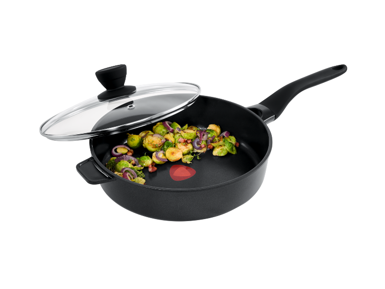 Frying pan with glass lid, featuring Brussels sprouts, onion, and bacon