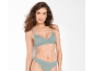 Woman in mint green ribbed bra and briefs with lace details.