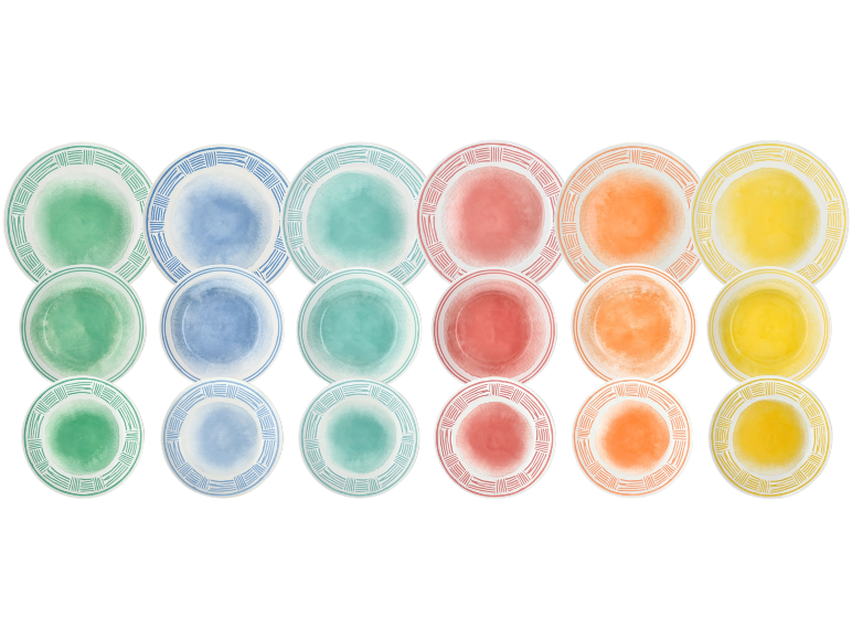 Pastel ceramic plates with decorated rims, stacked in three rows.