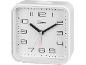 White square alarm clock with an analog time display and black numerals.