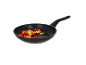 Frying pan with shrimp, cherry tomatoes, and herbs.