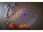 Spider web with purple lights, cobwebs, and Halloween pumpkins on a dresser.