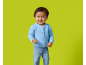 A toddler in a blue cardigan and jeans smiling.