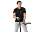 Man in black sports t-shirt and grey sweatpants holding battle ropes.