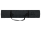 Rolled black yoga or fitness mat with a carrying strap.