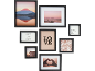 Nine black picture frames with various motifs, including a mountain, sea, text, and patterns.