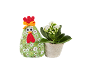 Fabric hen and potted plant with white flowers.