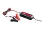 Battery charger with red and black clamps and cables.