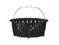Black plastic steamer basket with a metal handle, featuring slotted sides and a raised base.