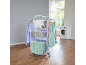 Clothes drying rack with laundry in a bright utility room.