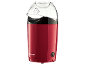 Red popcorn maker with a transparent lid and a black power switch.