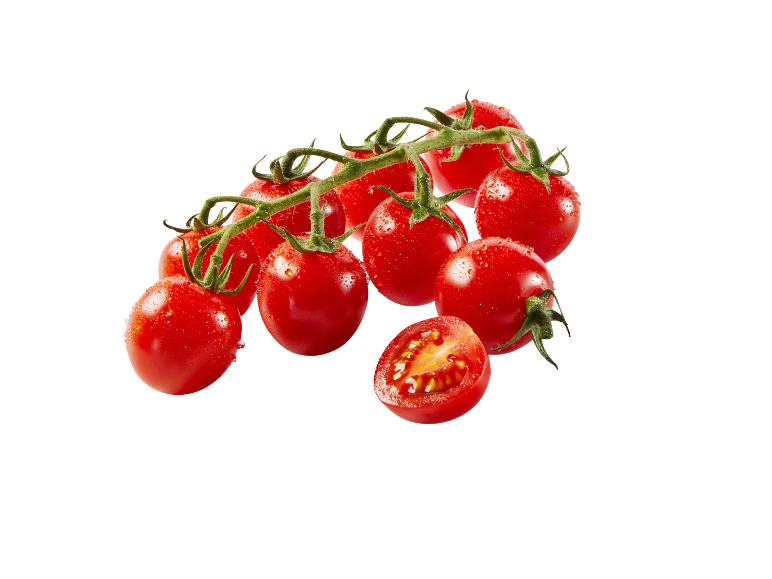 Cluster of cherry tomatoes with water droplets, one cut in half.