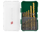 Set of golden drill bits in an open green case with a white lid.