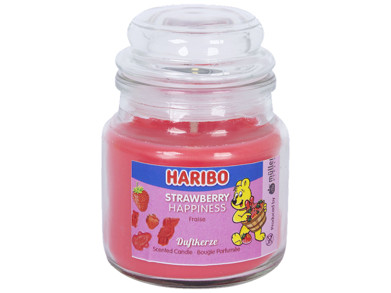 Red strawberry scented candle in a glass jar with a lid.