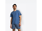 Man in blue t-shirt and striped boxer shorts.