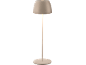 Beige table lamp with a round base and a conical shade.