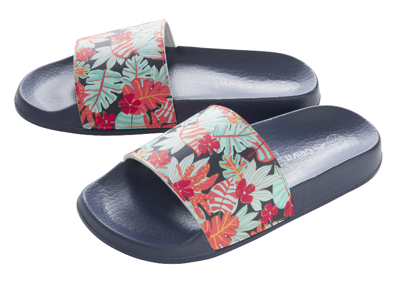 Navy blue slide sandals with a vibrant tropical floral pattern.