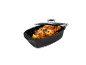 Roasted chicken in a roasting pan with a glass lid