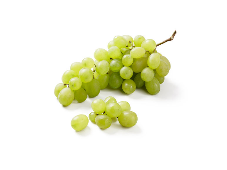 Fresh bunch of white grapes with some scattered grapes on a white background.