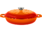 Orange cast iron pot with handles and lid