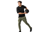 Man in black t-shirt and green trousers holding a medicine ball.
