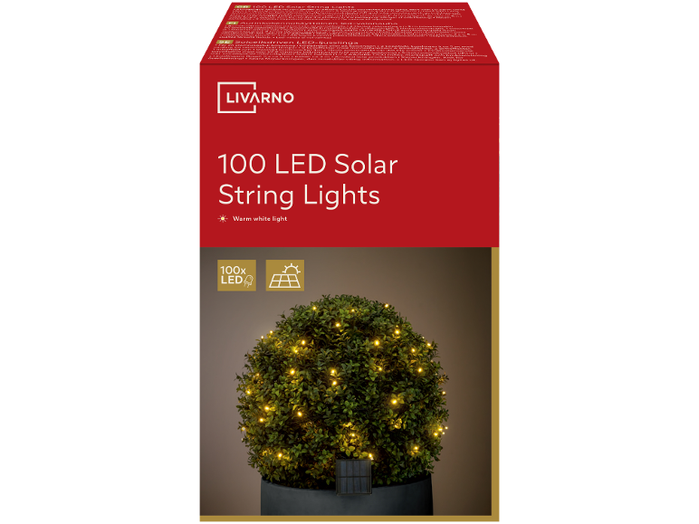 100 warm white LED solar string lights on a green bush in a pot.
